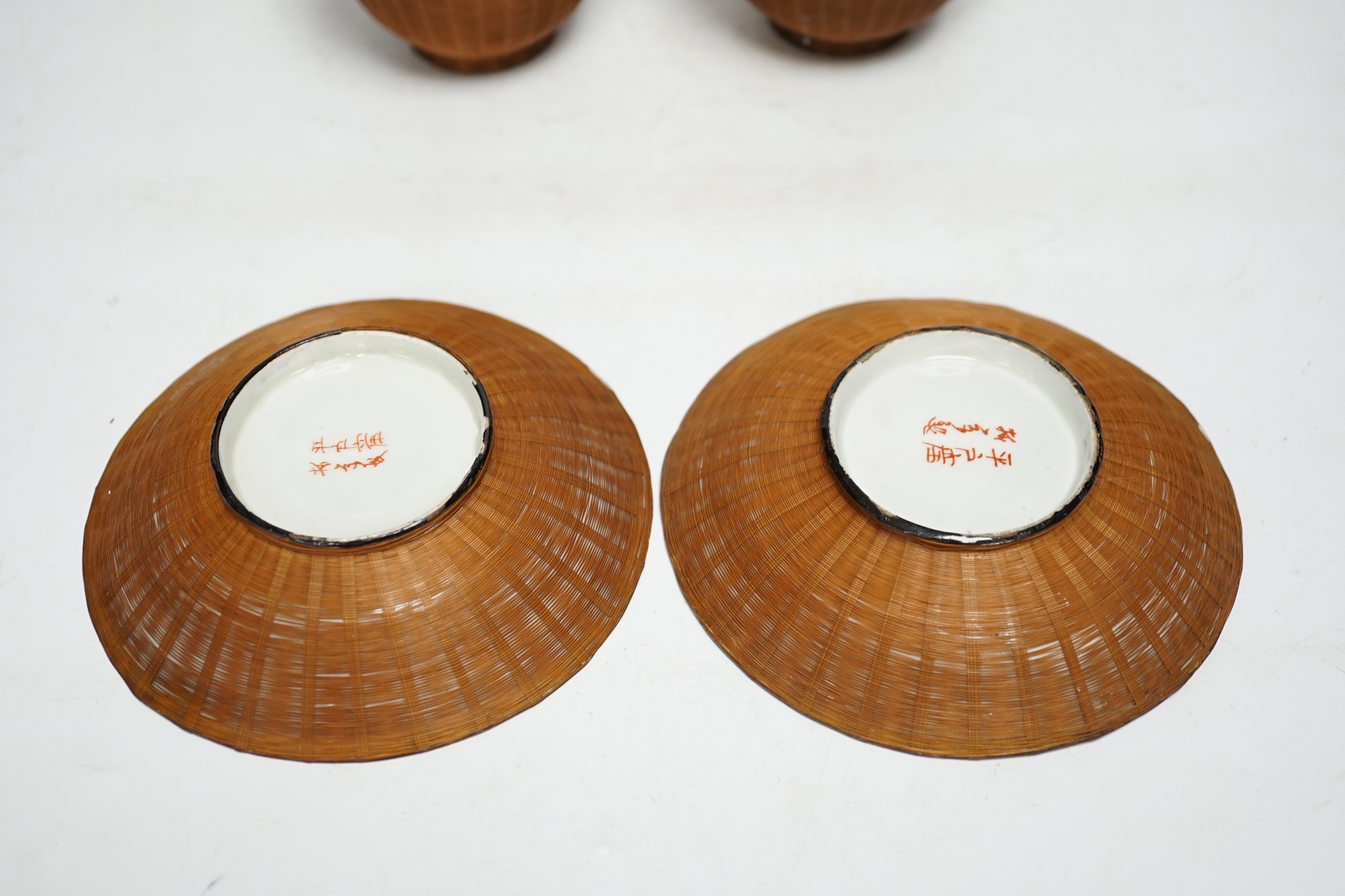 Two pairs of Japanese bamboo bound tea bowls and saucers. Condition - fair